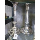 A pair of silver plated candlesticks