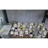 A large collection of silver plated mustard pots