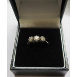 A fine quality three stone diamond ring set in 18 carat gold and platinum.