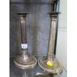 A pair of silver plated candlesticks