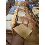 A set of six 1970s teak dining chairs with broad top rails and turned legs