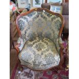 A pair of French Louis XV style Bergere chairs, stamped Marcel on the leg, with floral carved top