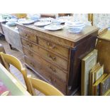 A George III crossbanded mahogany chest of drawers, the rectangular top with moulded edge over two