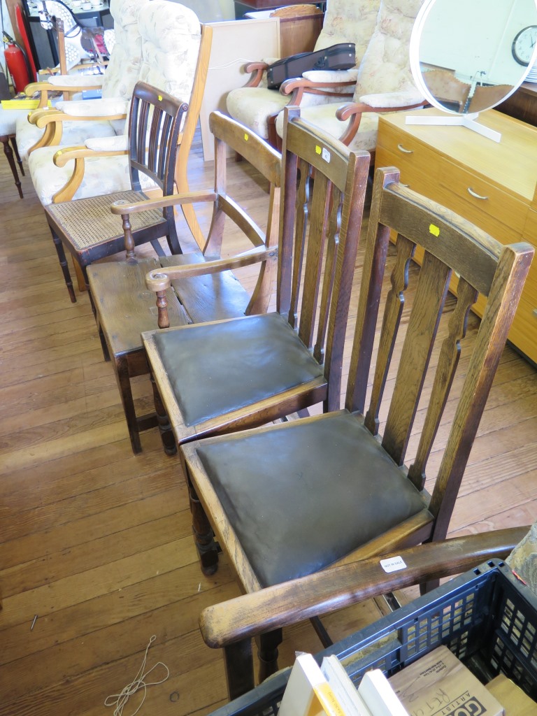 A 19th century elm carver chair, with scroll arms on turned supports and square legs, and a pair