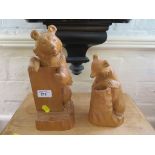 Two wood carved Russian bears, one modelled for holding a notepad, the other as a pen holder
