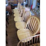A set of six Windsor type ash kitchen chairs, with hoop back