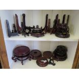 Various folding plate stands and Chinese hardwood vase stands