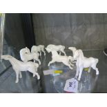Seven white Ceramic horses, possibly Chinese, 8cm high