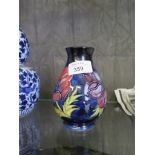 A Moorcroft Anemone baluster vase with blue ground, 13cm high