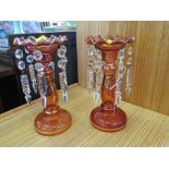 A pair of Victorian red glass table lustres with glass pendants and gilt decoration, 22cm high
