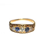A sapphire and diamond five stone ring set in gold colour shank