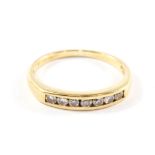 A diamond half eternity ring set in 18 carat gold