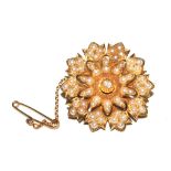 An Edwardian pearl and diamond set flower head brooch