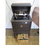 An early 20th century Dictaphone shaving machine in a domed timber case with transfer label and