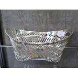 A continental silver bread basket of pierced decoration with beaded edge on four pierced feet