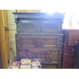 A 17th century oak court cupboard, the scroll carved frieze initialled A.W. and dated 1680 over a