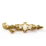 A 9 carat gold bar brooch set with three opals