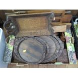 A set of four graduated carved hardwood trays, and various other carved wood treen ornaments and