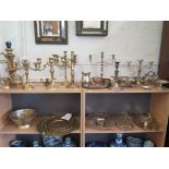 Various brass candelabra and candlesticks, brass trays, a bowl and various silver plated wares