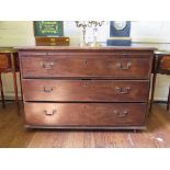 A George III mahogany chest of drawers with brush slide and three long graduated drawers on later