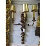 A pair of 19th century giltwood triple wall lights carved with rose flowers, acorns and husks 66cm
