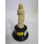 A 19th century ivory carving of a Madonna on later base, 12cm high
