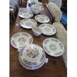 A Bridgewood China set of Rhodian dinner plates, two tureens, and sauce boat retailed by Waring &