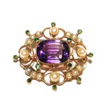 A Victorian 15 carat gold Suffragette brooch set with amethyst, pearls and peridots (boxed)