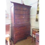A George III mahogany chest on chest, the dentil cornice over a blind fret carved frieze and