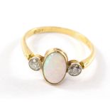 An opal and diamond three stone ring