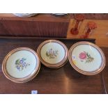 A pair of Edwardian low comports, a tall comport and five plates, all painted with flowers on