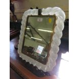 A continental table mirror, with opaque air twist glass border, 1930's 41cm x 34cm