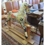 A dapple grey rocking horse, with hair mane and tail, 130cm wide