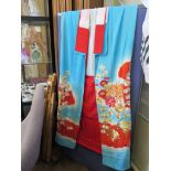 A Japanese uchikake wedding kimono, in pale blue and red, a pair of Japanese shoes and other fabric