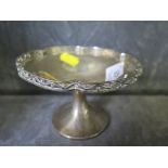 A silver bowl on single foot