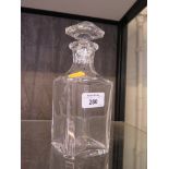 A Baccarat glass decanter with stopper, 21cm high