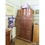 A 19th century Biedermeier flame mahogany secretaire a abattant, the superstructure with three