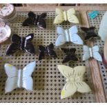 Ten ceramic butterfly wall pockets, in blue, yellow, green and black