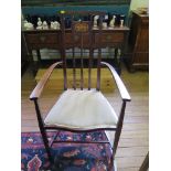 An Art Nouveau mahogany open armchair, with stylised floral motif inlay on square tapering legs