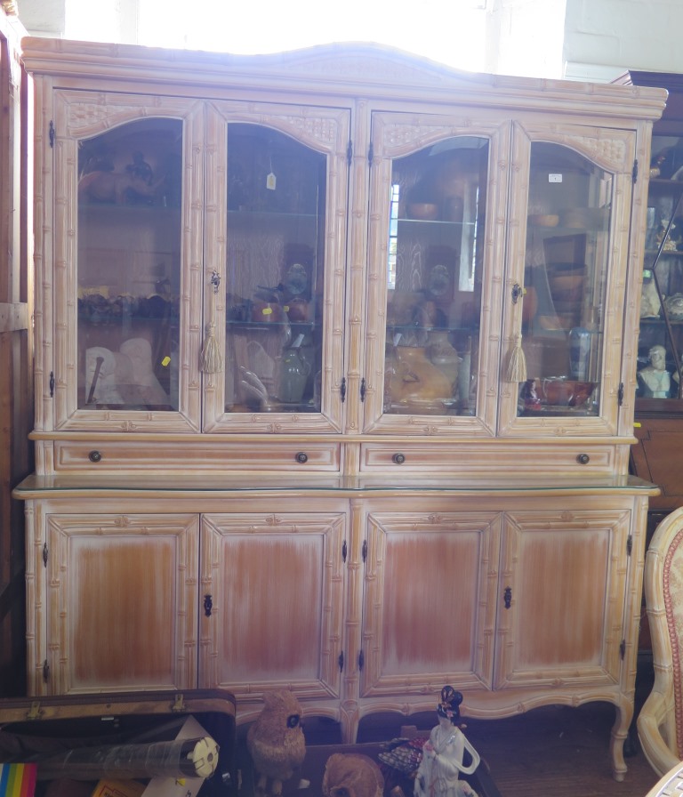 A limed bamboo effect dining room suite, comprising dining table, with caned and glazed top 220cm