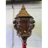 A Venetian style carved giltwood standard light, the lantern top on a red velvet stem and