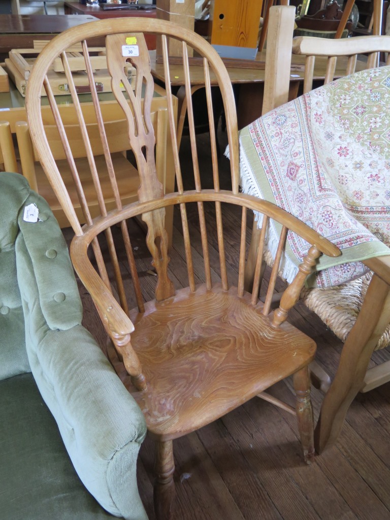 An ash and elm high back Windsor armchair, with crinoline stretcher