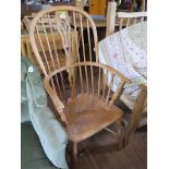 An ash and elm high back Windsor armchair, with crinoline stretcher