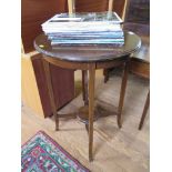 A mahogany circular occasional table, with undershelf and slightly outsplayed legs