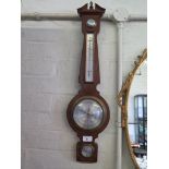 A mahogany and ebony strung banjo barometer by Comitti of London, with swan neck pediment,