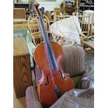 A baby cello, labelled Lowendall Berlin, length of two piece back 61.5cm, and a bow