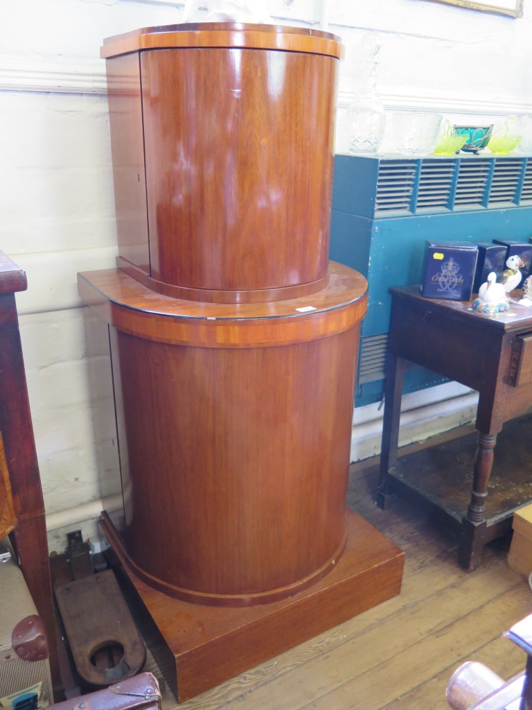 A continental Art Deco mahogany demi lune cabinet, the two stepped tiers with satinwood