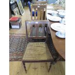 A Regency stained wood dining chair, with cane seat, and two oak dining chairs (3)