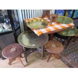 Three brass top Middle Eastern occasional tables, and various carved Indian tables