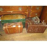 A leather suitcase, 57cm wide, a tin trunk and four other suitcases